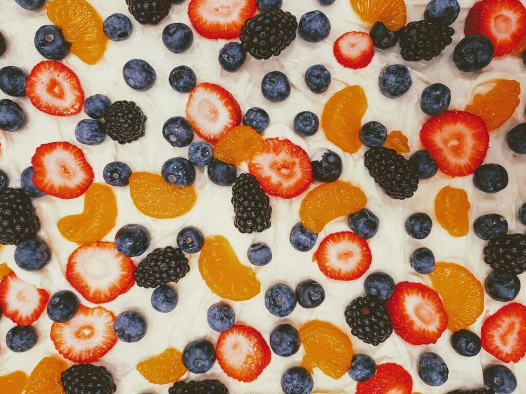 Frozen yogurt bark topped with strawberries, blueberries, blackberries and mandarin slices
